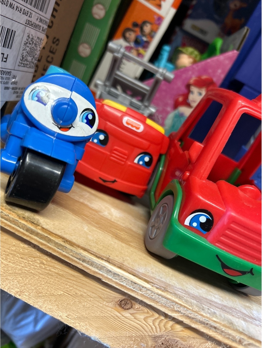 Three Fisher-Price Little People vehicles